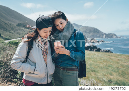 people hiking in countryside seascape in Big Sur 49273702