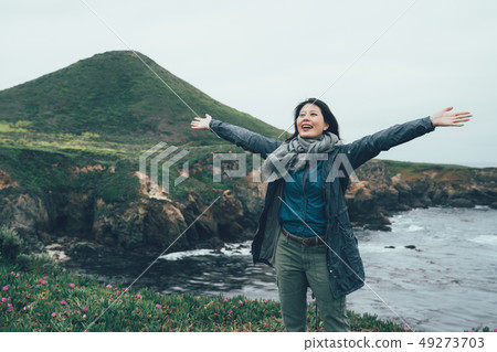 freedom girl enjoy on top of mountain 49273703