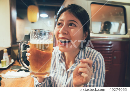 pretty girl worker having alcohol after work. 49274063