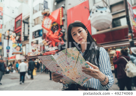 traveler hold map discover tourist attraction 49274069