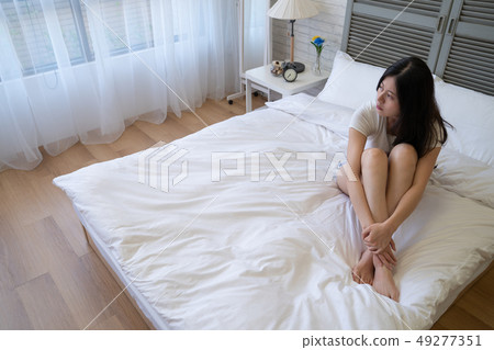 woman suffering from depression looking window woman suffering from depression looking window 49277351