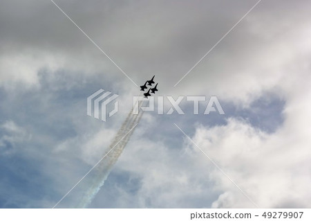 Formation of the US Navy's F-18 fighter flying in the sky 49279907