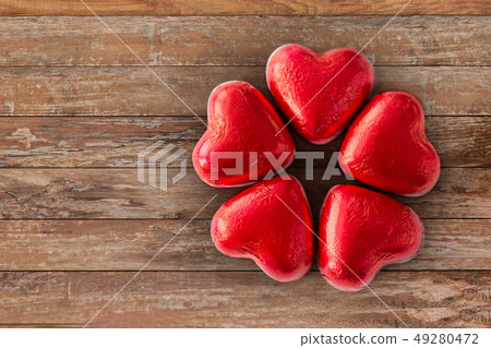 close up of red heart shaped chocolate candies close up of red heart shaped chocolate candies 49280472