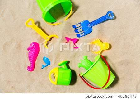 close up of sand toys kit on summer beach close up of sand toys kit on summer beach 49280473