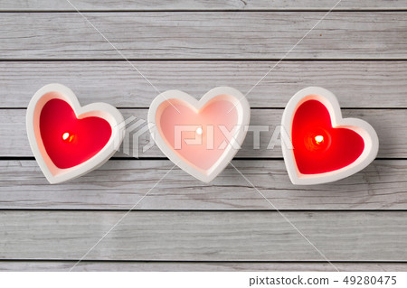 heart shaped candles burning on valentines day heart shaped candles burning on valentines day 49280475