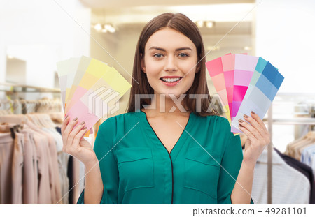 woman with color swatches at clothing store woman with color swatches at clothing store 49281101