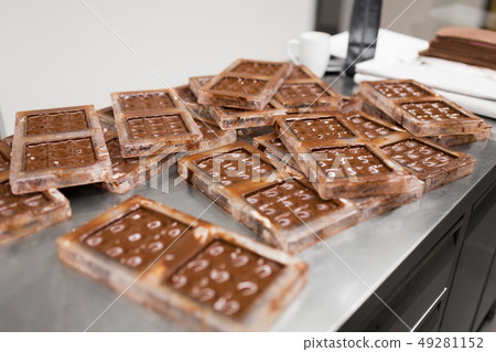 chocolate in candy molds at confectionery shop chocolate in candy molds at confectionery shop 49281152