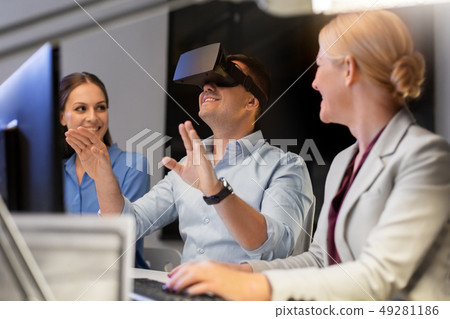 business team with computer working late at office 49281186