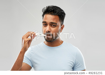 man measuring oral temperature by thermometer man measuring oral temperature by thermometer 49281231