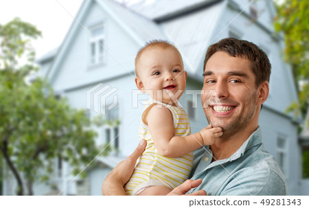 happy father holding baby daughter over house happy father holding baby daughter over house 49281343