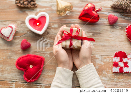 hands holding christmas or valentines day gift hands holding christmas or valentines day gift 49281349