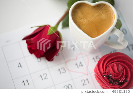 close up of calendar, coffee, cupcake and red rose close up of calendar, coffee, cupcake and red rose 49281350