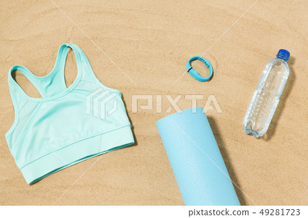 sports top, mat, fitness tracker and water bottle 49281723