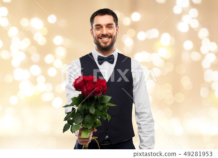 happy man with bunch of red roses 49281953