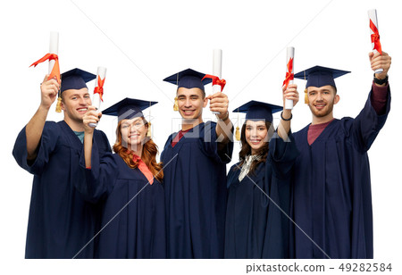 graduates in mortar boards with diplomas 49282584