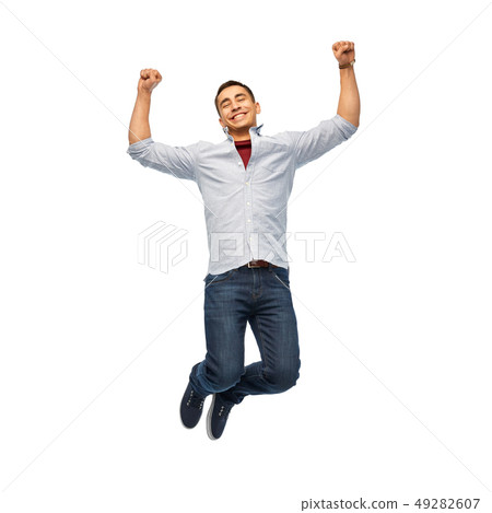 happy young man jumping over white background happy young man jumping over white background 49282607