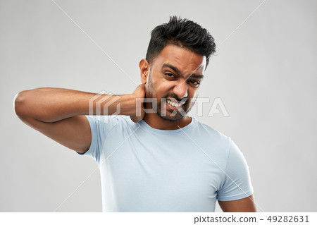 unhealthy indian man suffering from neck pain unhealthy indian man suffering from neck pain 49282631