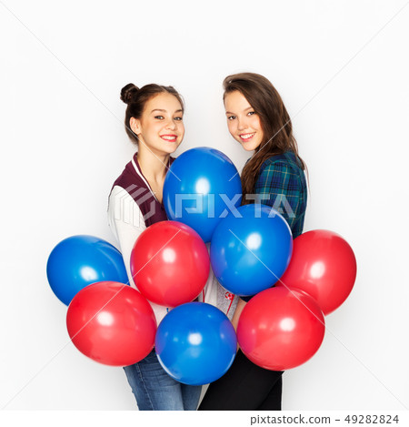 happy teenage girls with helium balloons 49282824
