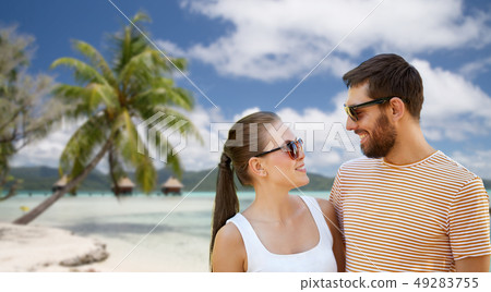 happy couple in sunglasses outdoors in summer 49283755