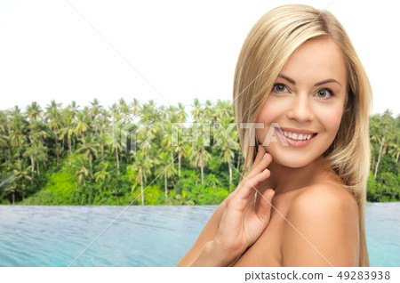 happy woman over infinity edge pool in sri lanka 49283938