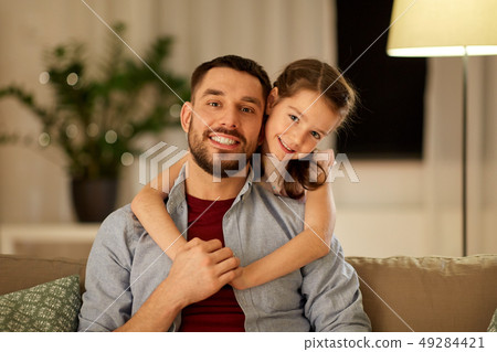 happy father and little daughter hugging at home happy father and little daughter hugging at home 49284421