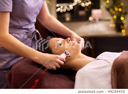woman having hydradermie facial treatment in spa woman having hydradermie facial treatment in spa 49284450