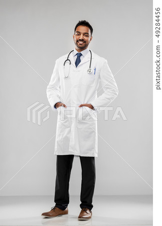 smiling indian male doctor with stethoscope smiling indian male doctor with stethoscope 49284456