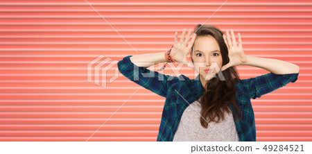 happy teenage girl making face and having fun happy teenage girl making face and having fun 49284521