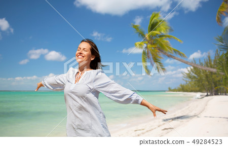 happy woman over tropical beach background happy woman over tropical beach background 49284523