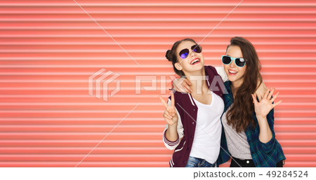 happy teenage girls in sunglasses showing peace happy teenage girls in sunglasses showing peace 49284524