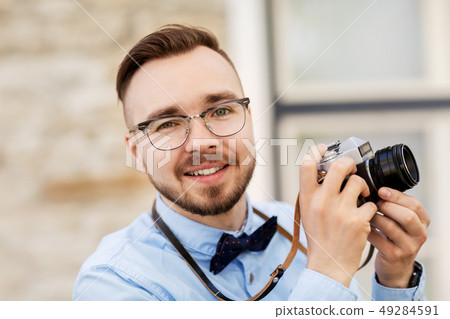 photographer or hipster with film camera outdoors photographer or hipster with film camera outdoors 49284591