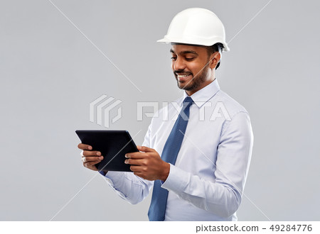architect or businessman in helmet with tablet pc architect or businessman in helmet with tablet pc 49284776