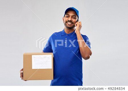 indian delivery man with smartphone and parcel box 49284834