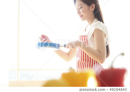 Woman cooking Woman cooking 49284843
