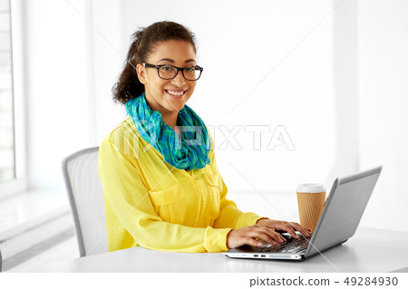 creative woman with laptop and coffee at office creative woman with laptop and coffee at office 49284930