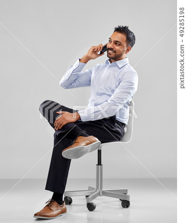 indian businessman calling on smartphone indian businessman calling on smartphone 49285198