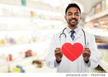 smiling indian male doctor with red heart shape smiling indian male doctor with red heart shape 49285366