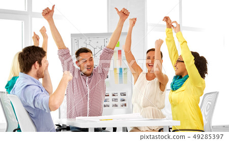happy creative team or designers at office happy creative team or designers at office 49285397