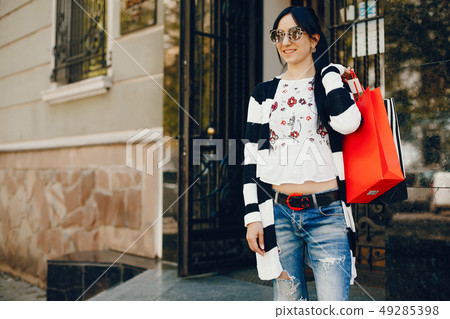 Stylish girl in a city Stylish girl in a city 49285398