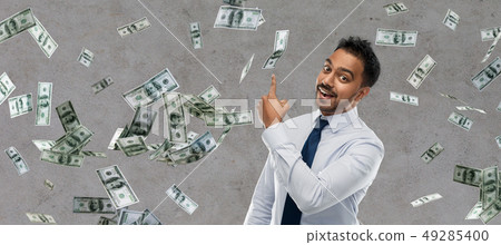 indian businessman pointing finger at money indian businessman pointing finger at money 49285400
