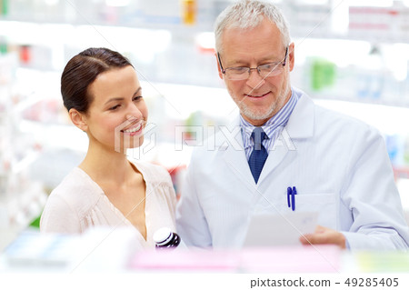 apothecary and woman with drug at pharmacy apothecary and woman with drug at pharmacy 49285405