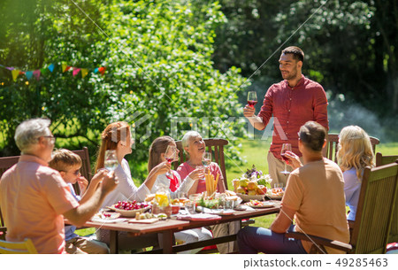 happy family having dinner or summer garden party happy family having dinner or summer garden party 49285463