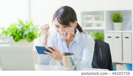 business woman play mobile game 49285739