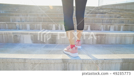 woman ready to run on stairs 49285773