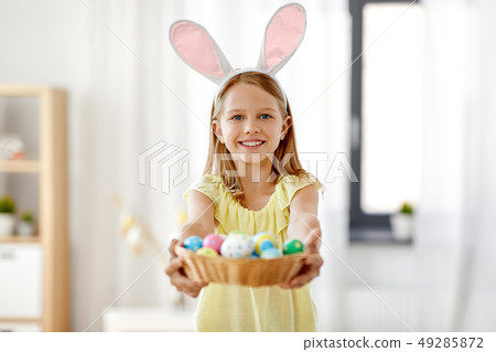 happy girl with colored easter eggs at home happy girl with colored easter eggs at home 49285872