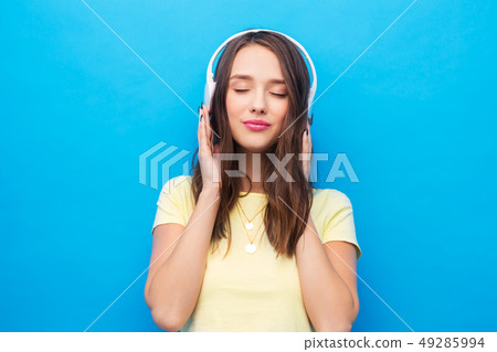 happy young woman or teenage girl with headphones happy young woman or teenage girl with headphones 49285994