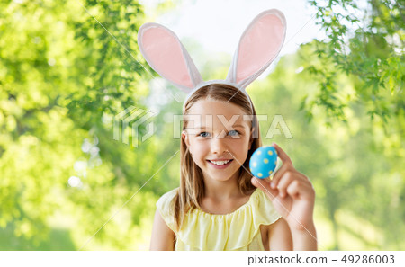 happy girl with colored easter egg 49286003