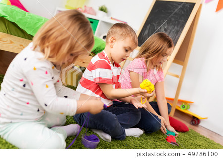 children with modelling clay or slimes at home children with modelling clay or slimes at home 49286100