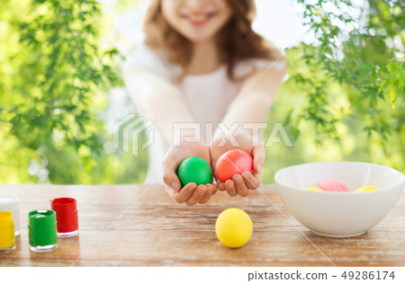 close up of girl holding colored easter eggs close up of girl holding colored easter eggs 49286174