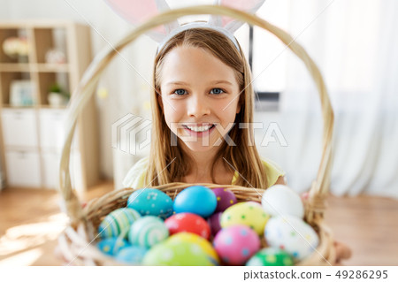 happy girl with colored easter eggs at home happy girl with colored easter eggs at home 49286295